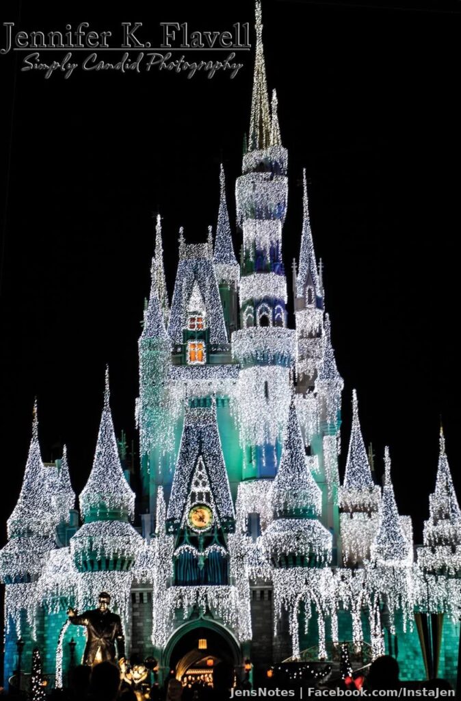 A picture of the "@[100044505456721:2048:Frozen]" castle with a green hue and the "Partners" statue out front (Walt Disney holding Mickey's hand). The castle varied