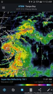 The center will pass pretty much overhead in a while. Not too bad at the moment but much heavier rain is on the way.