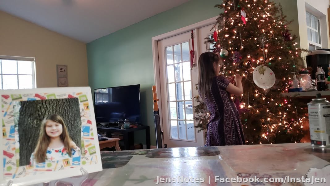 My Caitlyn adding her decorations to our tree!??