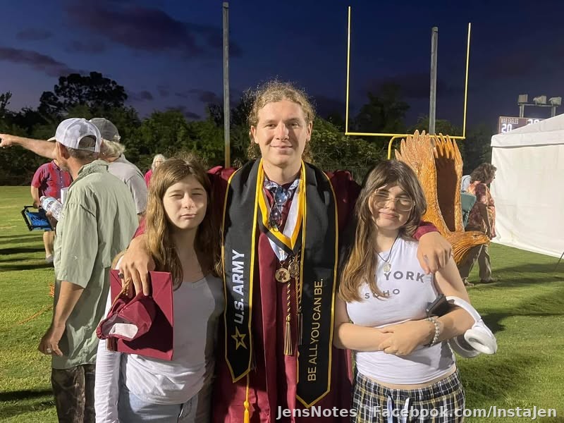@[100078377596062:2048:Andrew Flavell] with his sisters (@[100040355160126:2048:Ava Mellenballer] is his mini-twin) and Chris' mini-twin @[100039897923368:2048:Caitlyn Mellenballer] on the field at graduation. ?